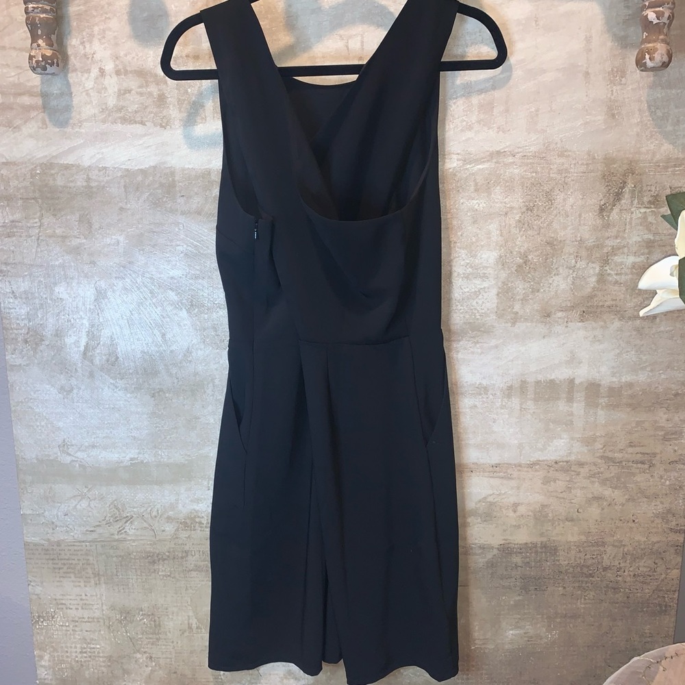 Black open back dress. Pockets NWT